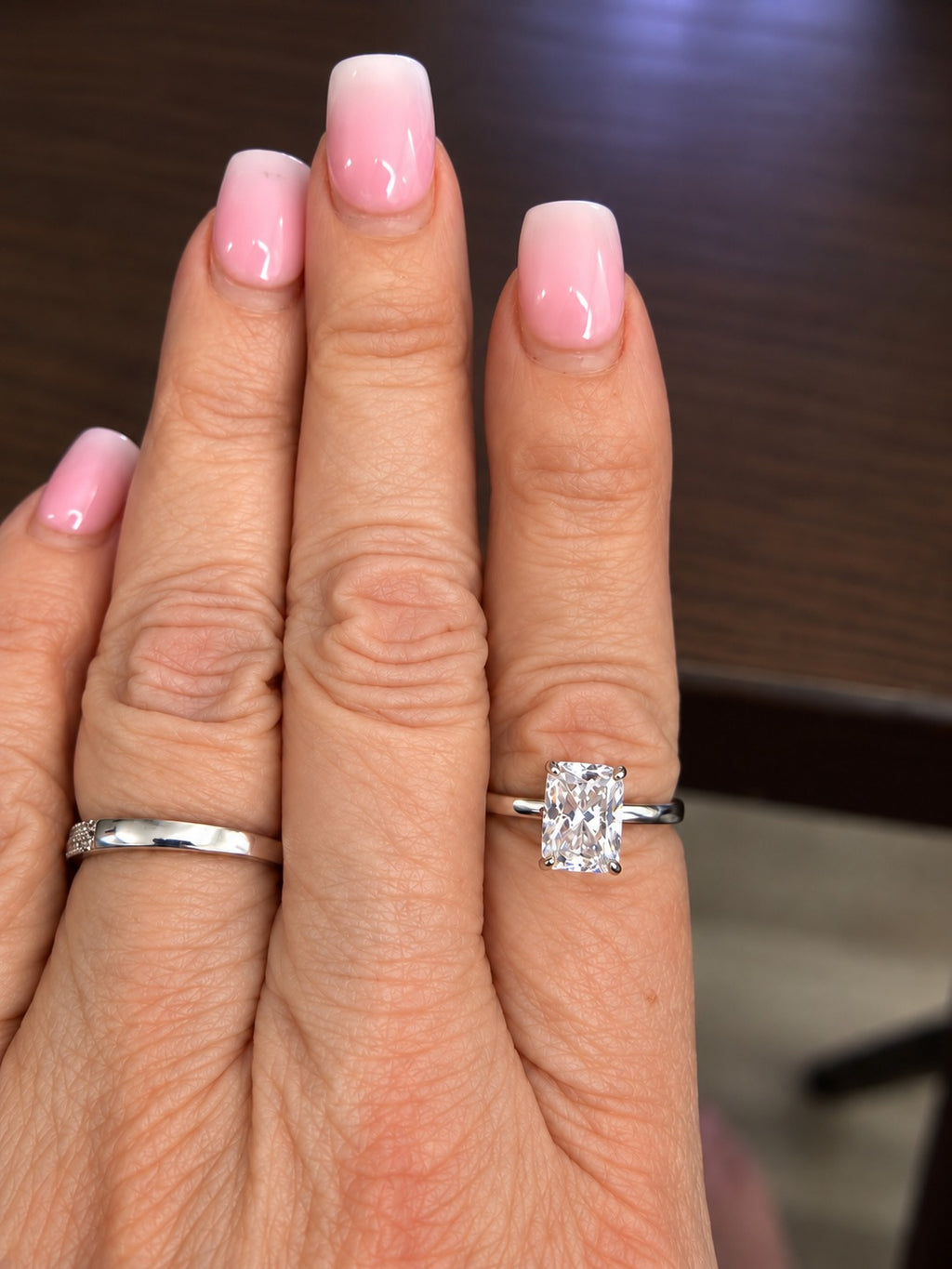 3 carat radiant-cut lab-grown diamond solitaire ring shown on hand