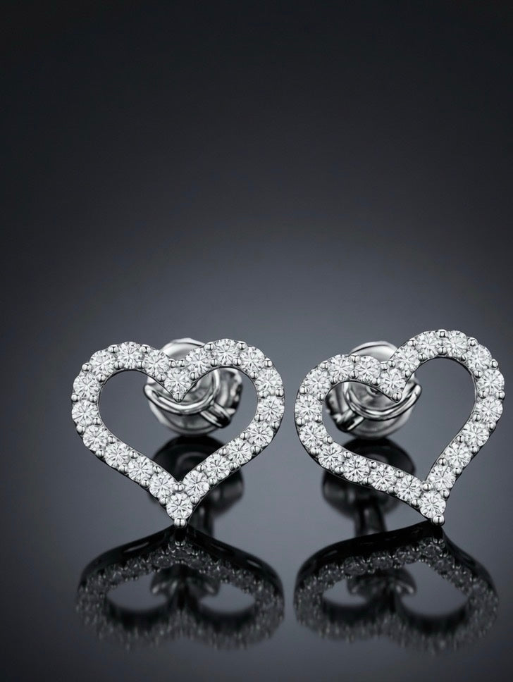 Angled view of lab-grown diamond open heart stud earrings in 18K white gold