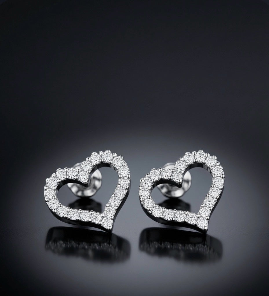 Tilted view of 18K white gold lab-grown diamond heart stud earrings