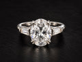 3 CTW oval lab-grown diamond ring with tapered baguette side stones in platinum