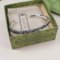 Gucci Interlocking G Flower Cuff Bracelet in Aged Sterling Silver — Medium in Gucci Box