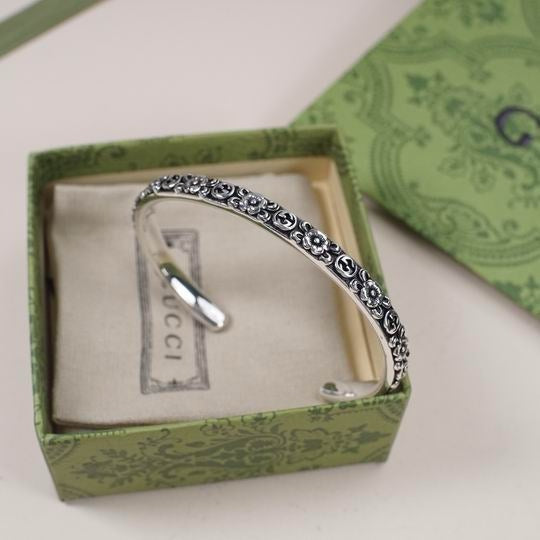 Gucci Interlocking G Flower Cuff Bracelet in Aged Sterling Silver — Side Detail View