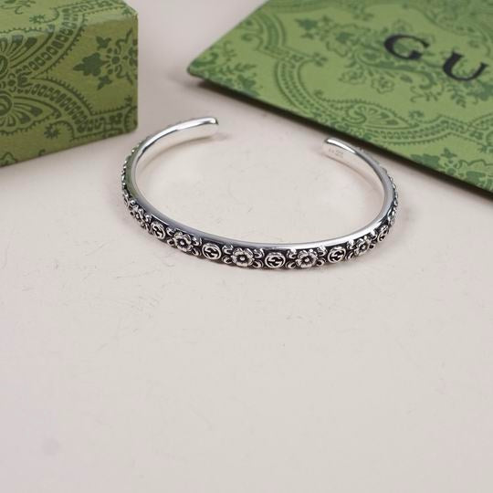 Gucci Interlocking G Flower Cuff Bracelet in Aged Sterling Silver — Flat View with Box
