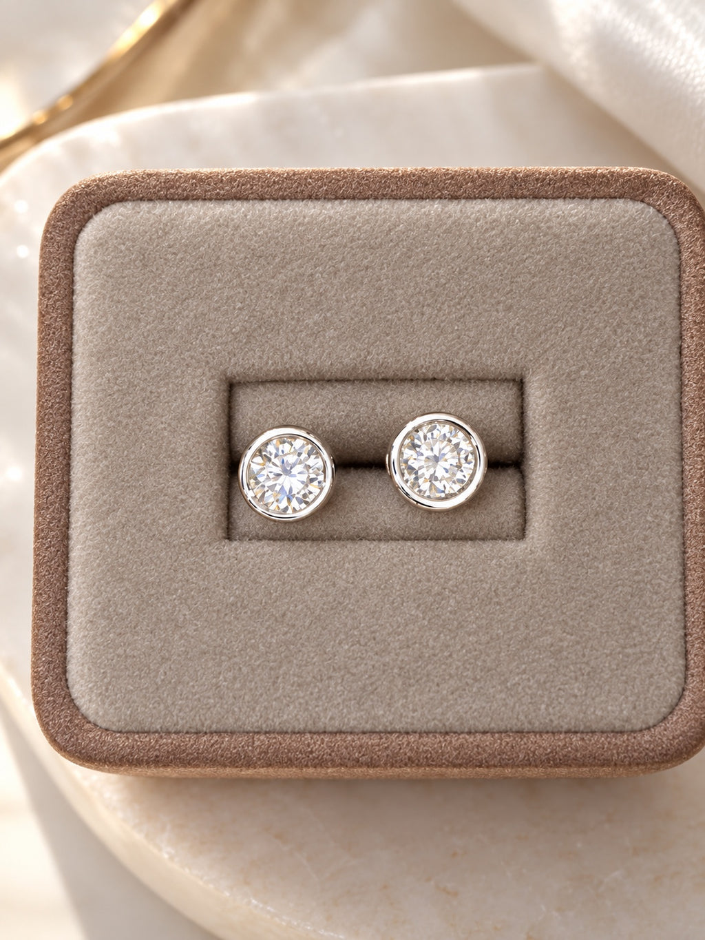 Round lab diamond stud earrings in 14K white gold bezel settings