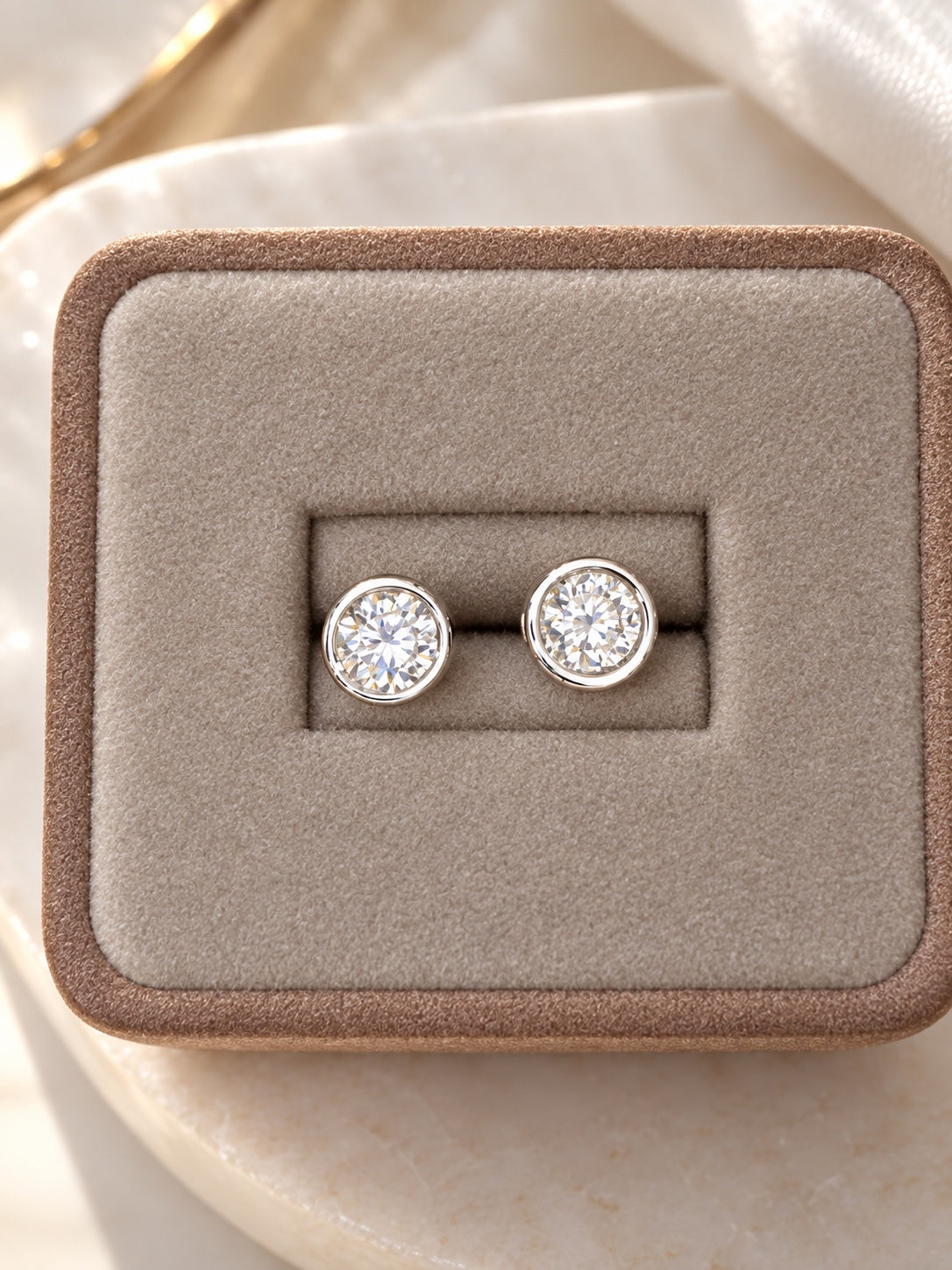 Round lab diamond stud earrings in 14K white gold bezel settings