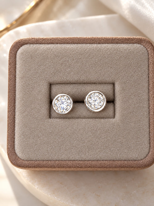 Round lab diamond stud earrings in 14K white gold bezel settings