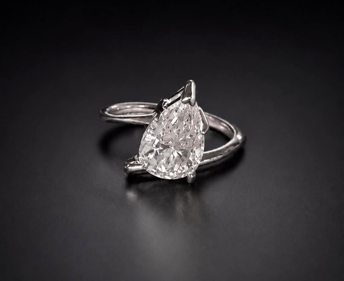 PHNX 4 carat pear-cut platinum ring size 7 side angle