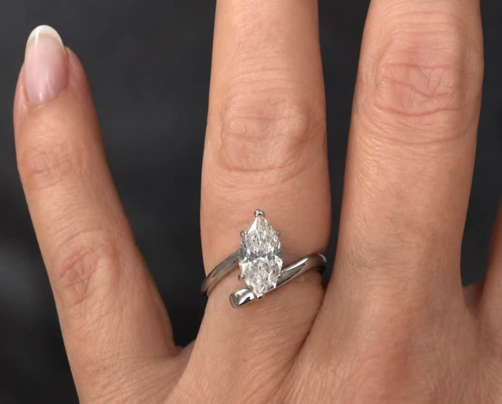 PHNX 4 carat pear-cut platinum ring size 7 on hand