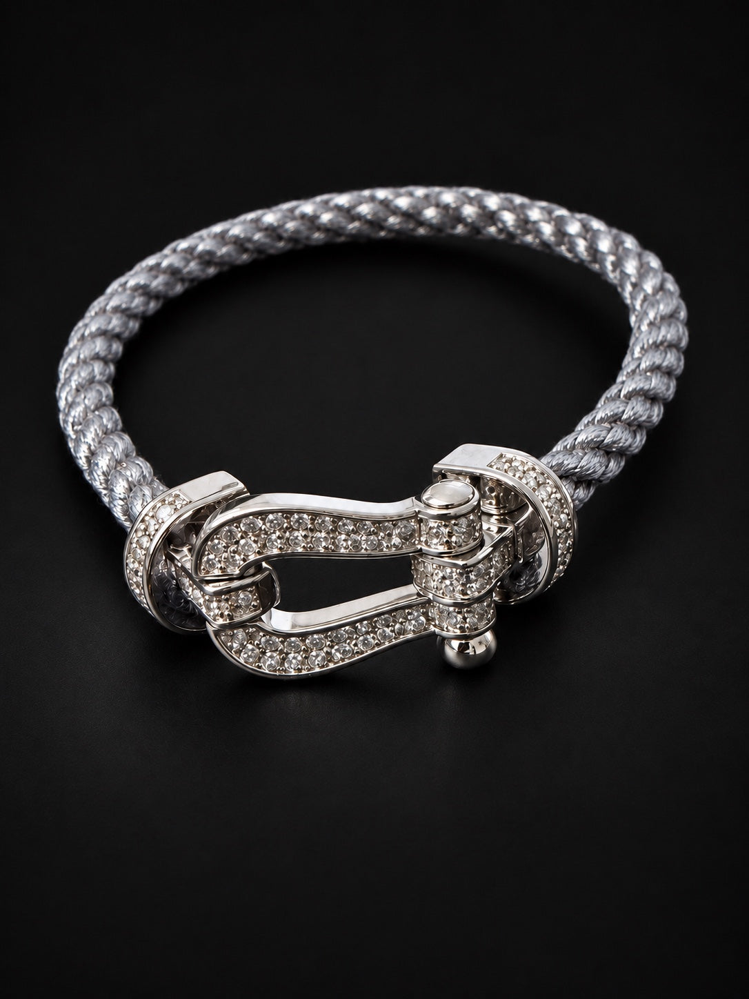 Close-up of PHNX silver horseshoe bracelet clasp with clear diamonds